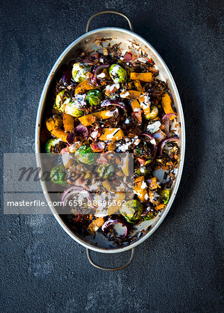 Roasted sweet pumpkins, brussels sprouts flavored with spices and tossed with wild rice topped with bacon bits and a lemon creme fraiche dressing Roasted sweet pumpkins, brussels sprouts flavored with spices and tossed with wild rice topped with bacon bits and a lemon creme fraiche dressing