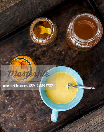 Golden milk (turmeric milk) with cinnamon and honey