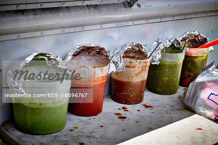 Various sauces for burritos in a street kitchen (USA)