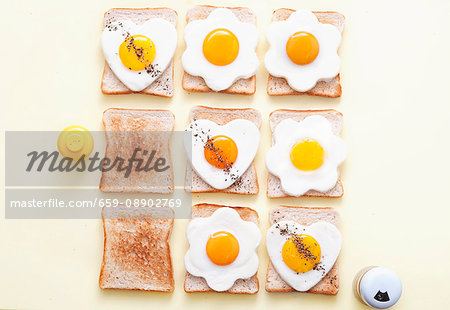 Slices of toast with fried eggs