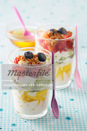 Layered yoghurt desserts with fresh fruit