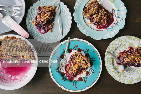 Portions of blueberry pie on plates