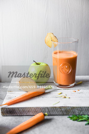 A glass of carrot, apple and ginger juice