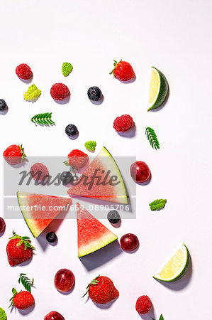 Assorted fresh fruits on a white background (a symbolic image for dieting)
