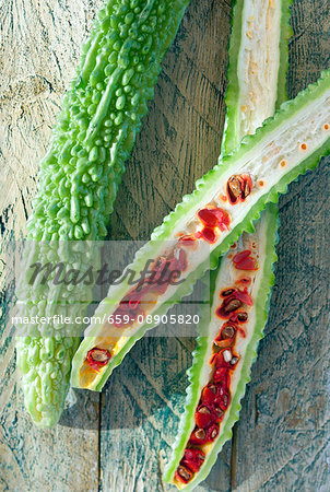 Bitter gourds, whole and halved