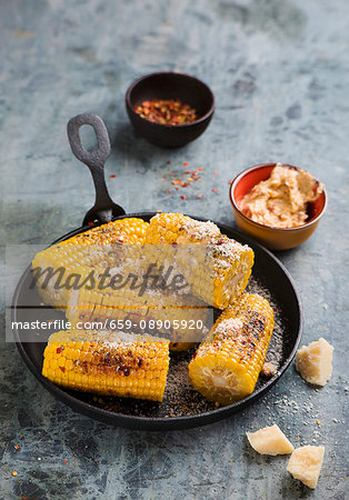 Grilled corn on the cob with herb butter and Parmesan