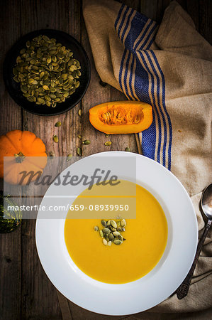 Cream of pumpkin soup with pumpkin seeds (seen from above) Cream of pumpkin soup with pumpkin seeds (seen from above)