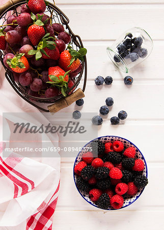 An arrangement of fresh berries and grapes