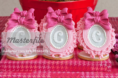 Elaborate sugar decorations with letters on shortbread biscuits