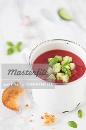 Tomato gazpacho with sliced cucumber and toast