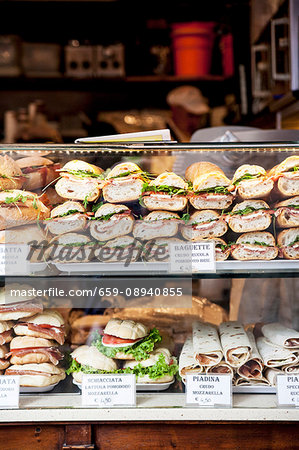 Various baguette sandwiches in a display cabinet