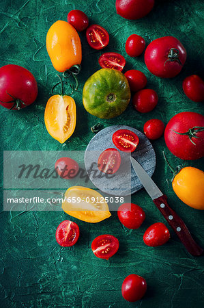 Various tomatoes, whole and halved