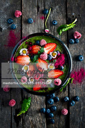 Green smoothie bowl with fresh fruits Green smoothie bowl with fresh fruits
