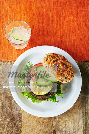 A burger with zucchini, tomato and cucumber A burger with zucchini, tomato and cucumber