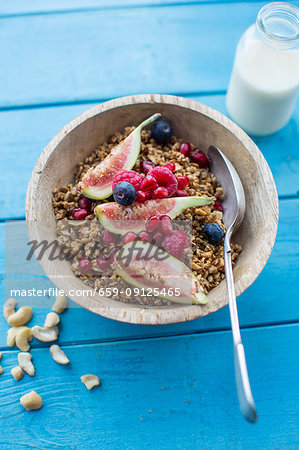 Granola with figs, berries and pomegranate seeds
