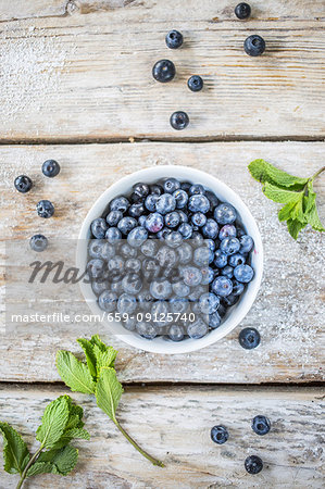 Blueberries in a white cup