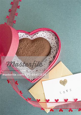 Heart-shaped chocolate and a love letter