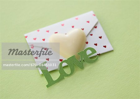 Heart-shaped chocolate and a love letter Heart-shaped chocolate and a love letter
