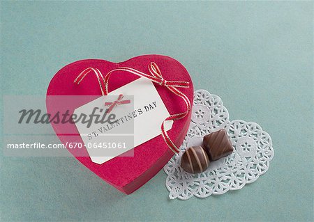 Heart-shaped gift box and chocolates Heart-shaped gift box and chocolates
