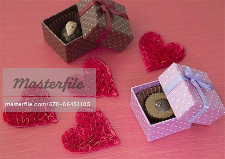 Chocolates in gift boxes and hearts