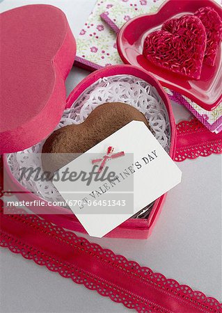 Heart-shaped chocolate and a message card Heart-shaped chocolate and a message card