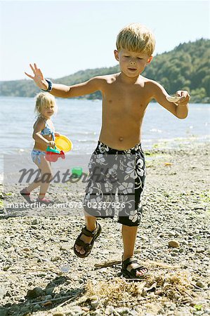 Premium Photo  Brother and sister playing fishing in the kiddie pool