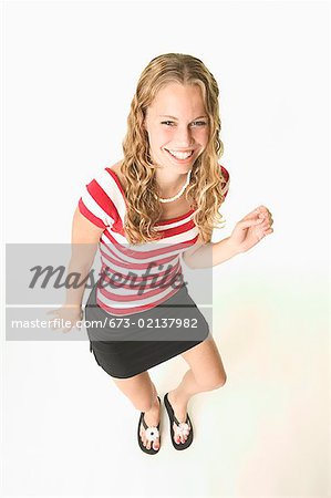 Pretty blond little girl in a white short dress Stock Photo by