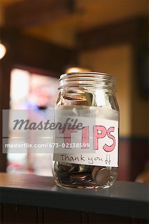 Still life of a full tip jar.