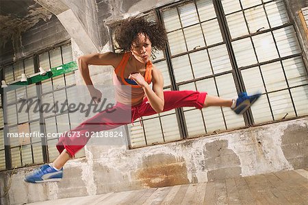 A young woman leaping in the air