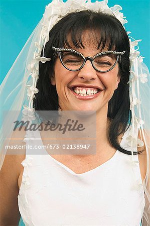 Portrait of bride wearing funny glasses