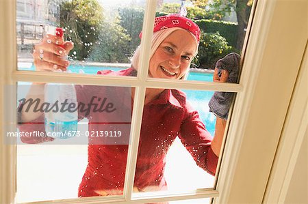 Woman cleaning windows