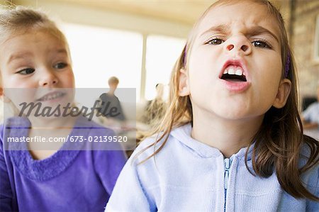 Girls Making Funny Faces Stock Photo Masterfile Premium Royalty Free Code 673