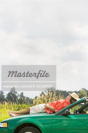 Man resting on car