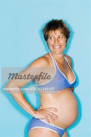 Portrait of pregnant woman in bikini - Stock Photo - Masterfile - Premium  Royalty-Free, Code: 673-02140437