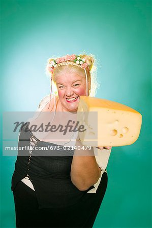 Woman in Germanic costume with cheese wedge