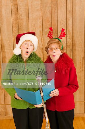 Elderly women singing at Christmastime
