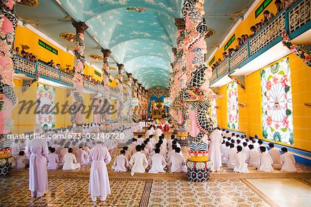 Rows of nuns and monks in Vietnamese temple