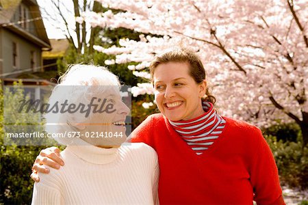 Mother laughing with grown daughter