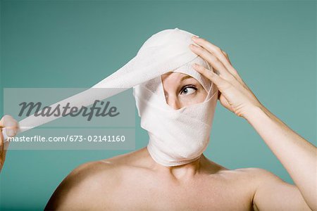 head wrapped in bandages