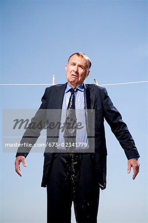 Businessman hung out to dry