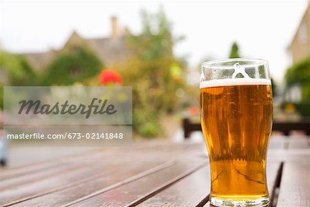 Pint of beer on outdoor pub table Cotswolds, United Kingdom