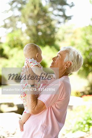 Senior woman holding baby