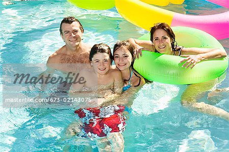 Family in swimming pool