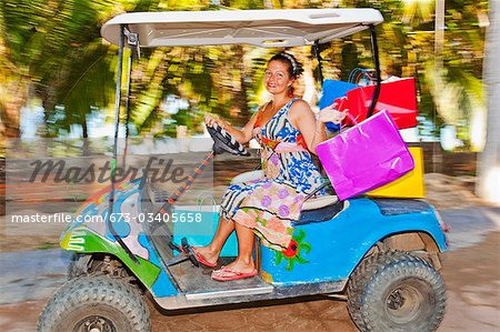 Woman shopping with golf cart in mexico