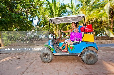 Woman shopping with golf cart in mexico