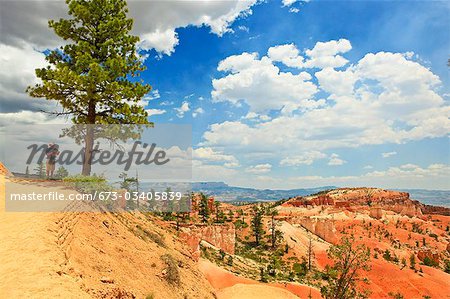 man standing on bluff in bryce canyon, utah