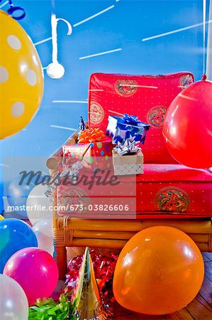 red chair with gifts and balloons