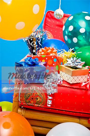 red chair with gifts and balloons