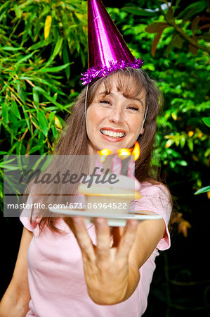 Woman with birthday cupcake