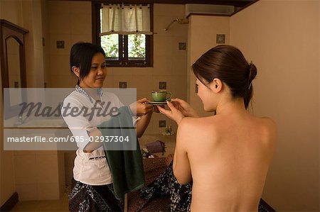 Young woman and massage therapist
